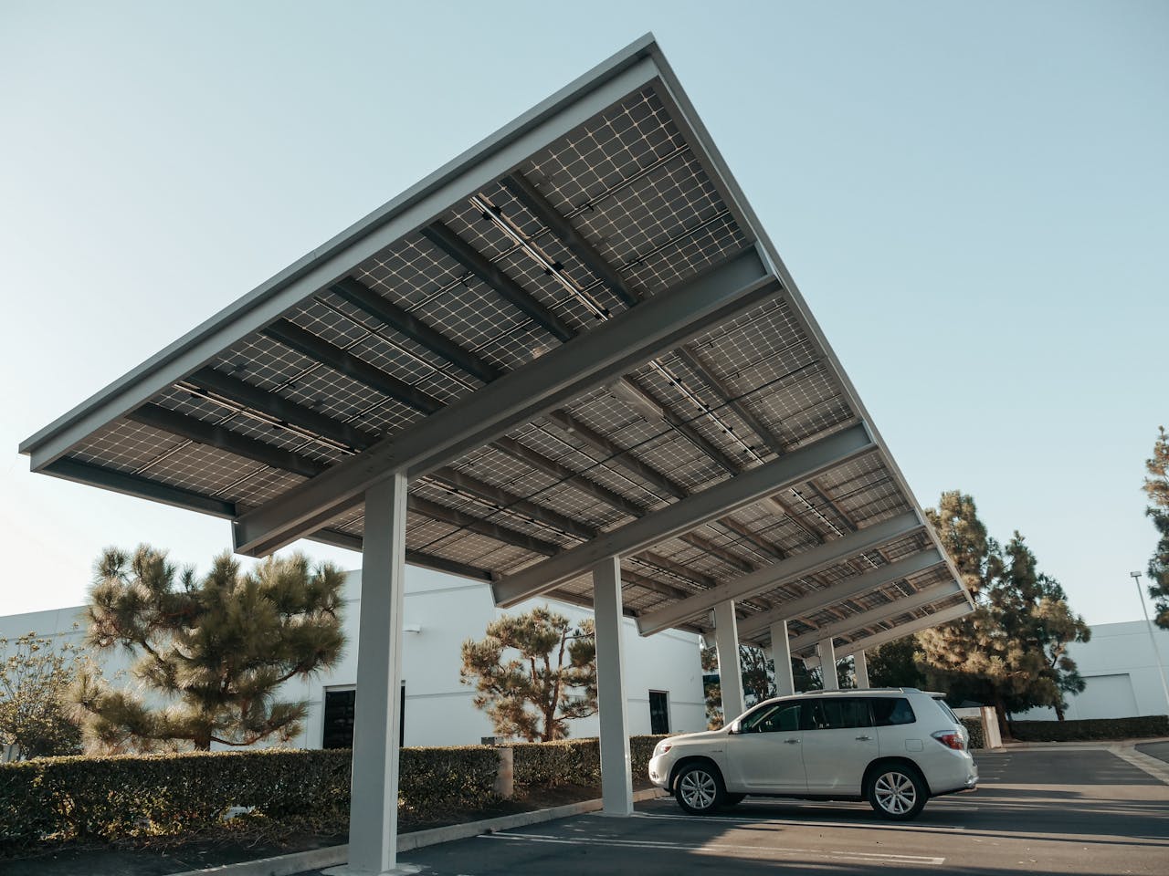 home-hero Solar panel carport in a modern urban setting, showcasing clean energy solutions.